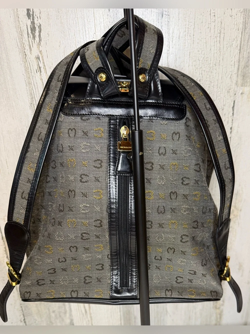 Metrocity Signature Canvas Backpack with black leather trim and gold hardware